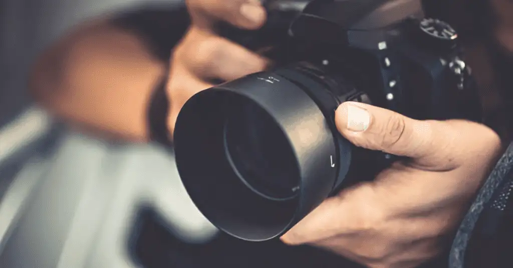 Camera placed by a cameramon with the headline 'Optimal Camera Settings for Dusk Shots' displayed on the screen