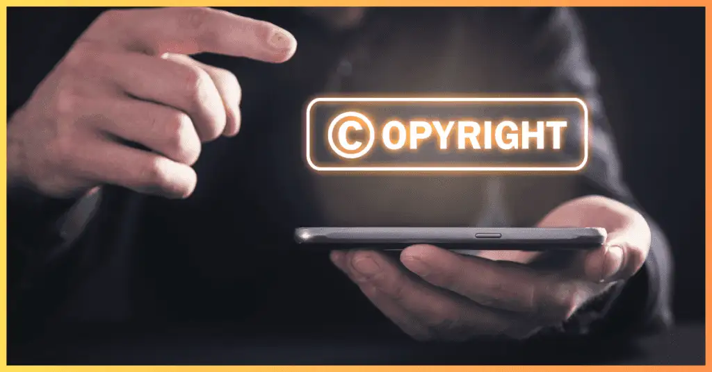 A person holding a smartphone with the word 'Copyright' displayed, symbolizing the protection of real estate photos and videos.