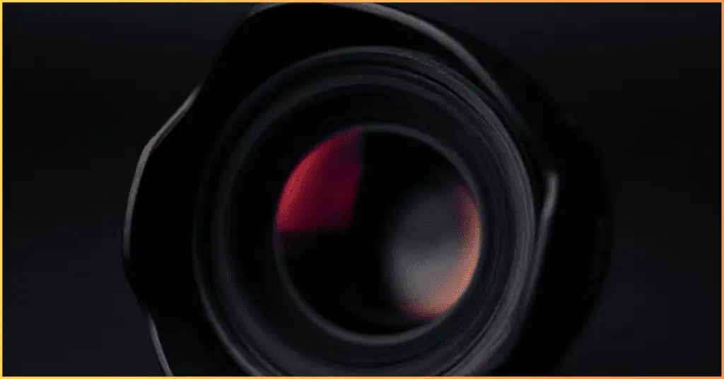 A camera with a lens hood attached, showing how to eliminate lens flare by blocking unwanted light.