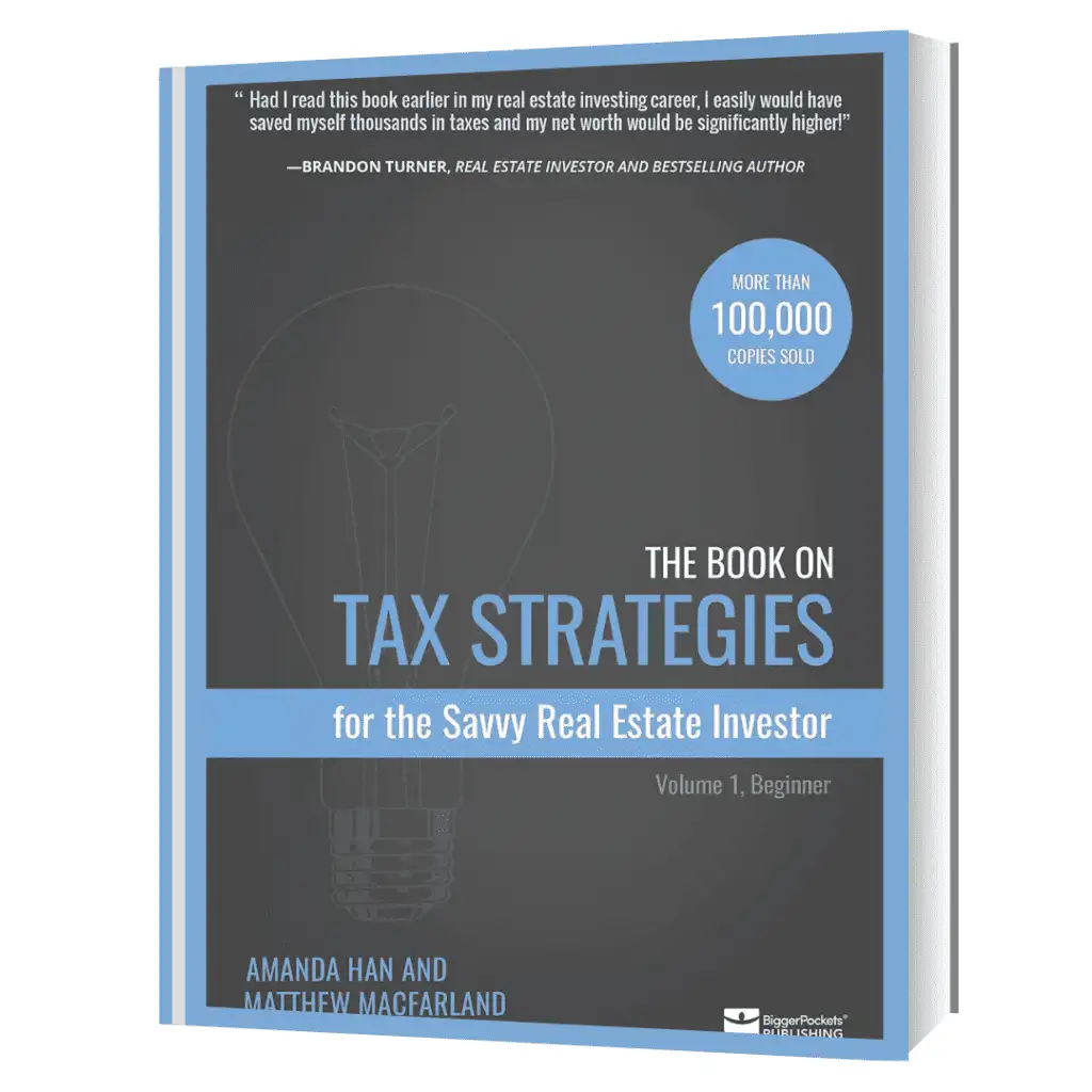 Cover of "The Book on Tax Strategies for the Savvy Real Estate Investor" by Amanda Han and Matt MacFarland, featuring a blue and black design with a lightbulb graphic and a "100,000+ Copies Sold" badge.