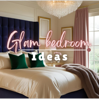 A luxurious bedroom featuring glam bedroom ideas with a navy velvet headboard, gold-framed nightstand, pink curtains, and a chandelier.