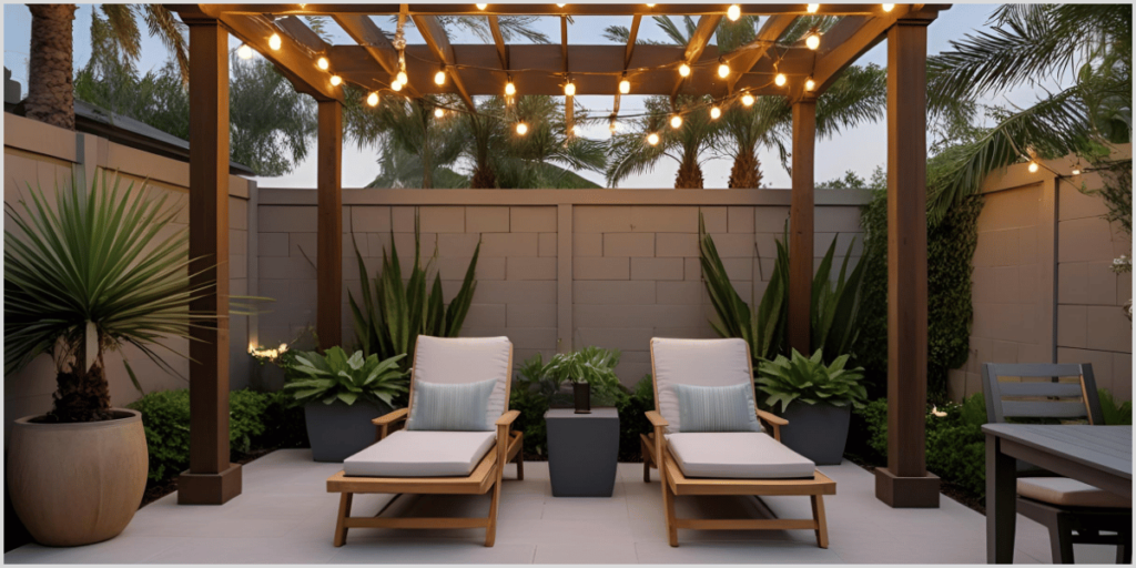 Outdoor patio with string lights, wooden lounge chairs, and lush plants under a pergola.