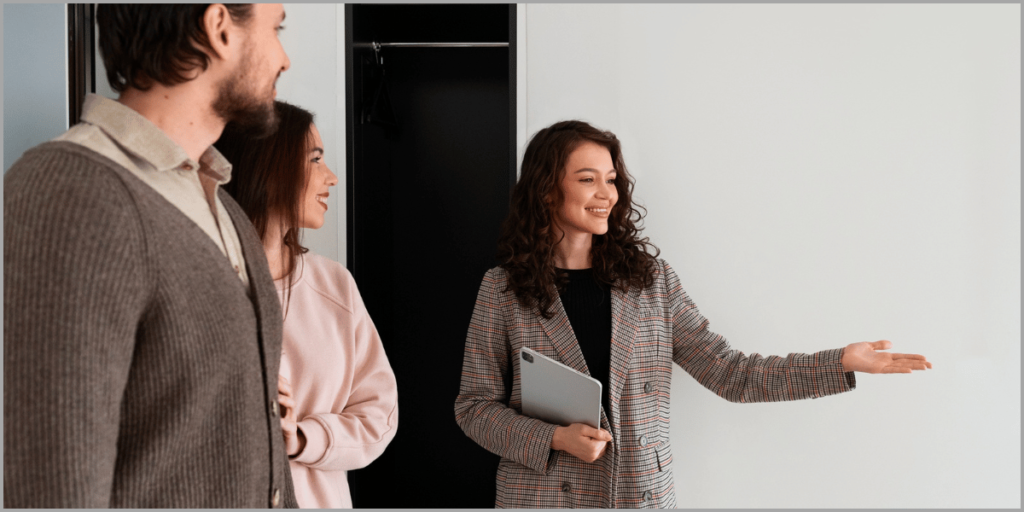 Real estate agent showing property to potential buyers using open house scripts.