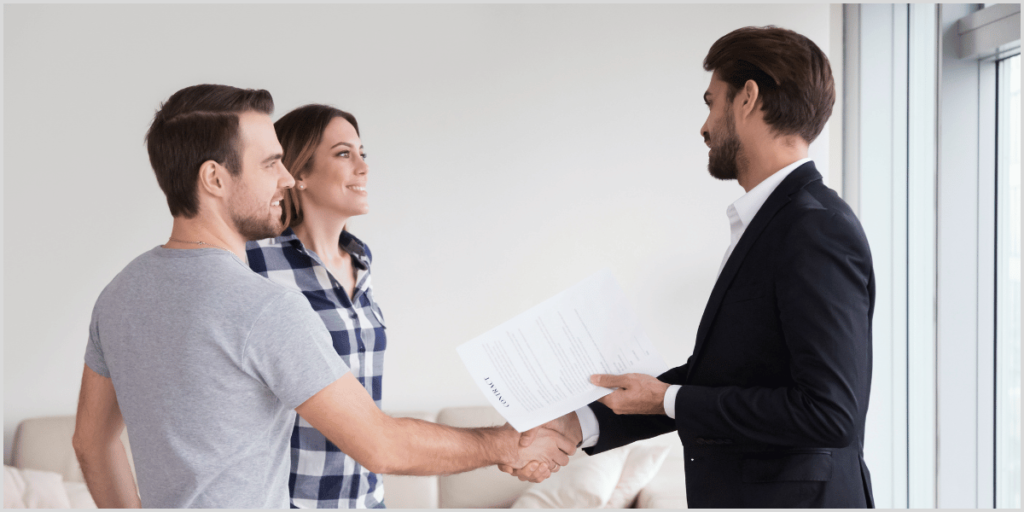 Real estate agent greeting visitors using open house scripts.