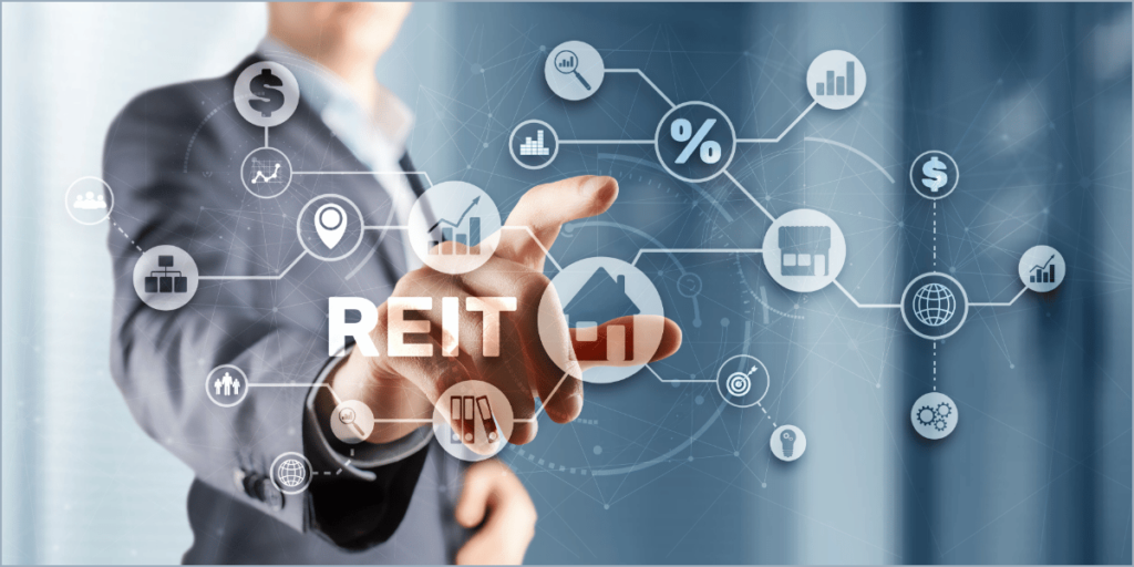 A person in a suit touching a holographic interface with "REIT" and icons like a house, graphs, and dollar signs, representing Real Estate Investing.