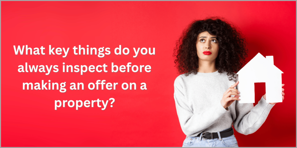 Woman holding a house cutout with text about property inspection.
