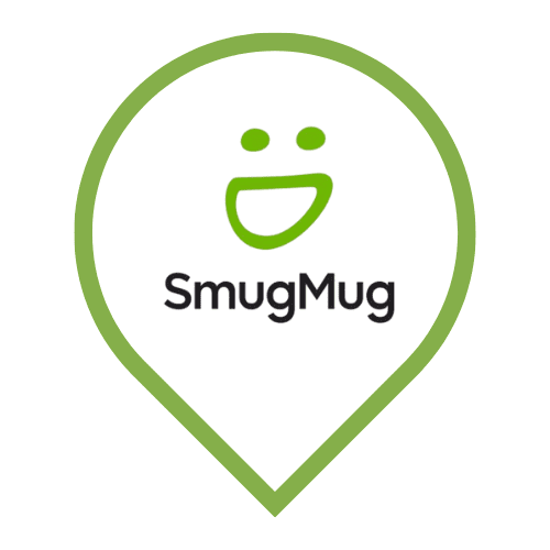 SmugMug app icon: a green smiley face with eyes and grin above the text "SmugMug" inside a green location pin outline.