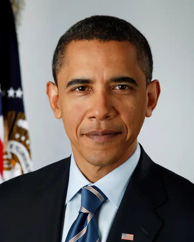 Barack Obama in official presidential portrait with American flag, serious expression – Who Is The Most Photographed Person In The World