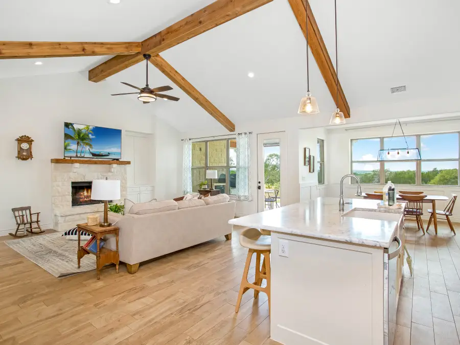 Bright real estate interior photo editing example for a listing-ready living room and kitchen