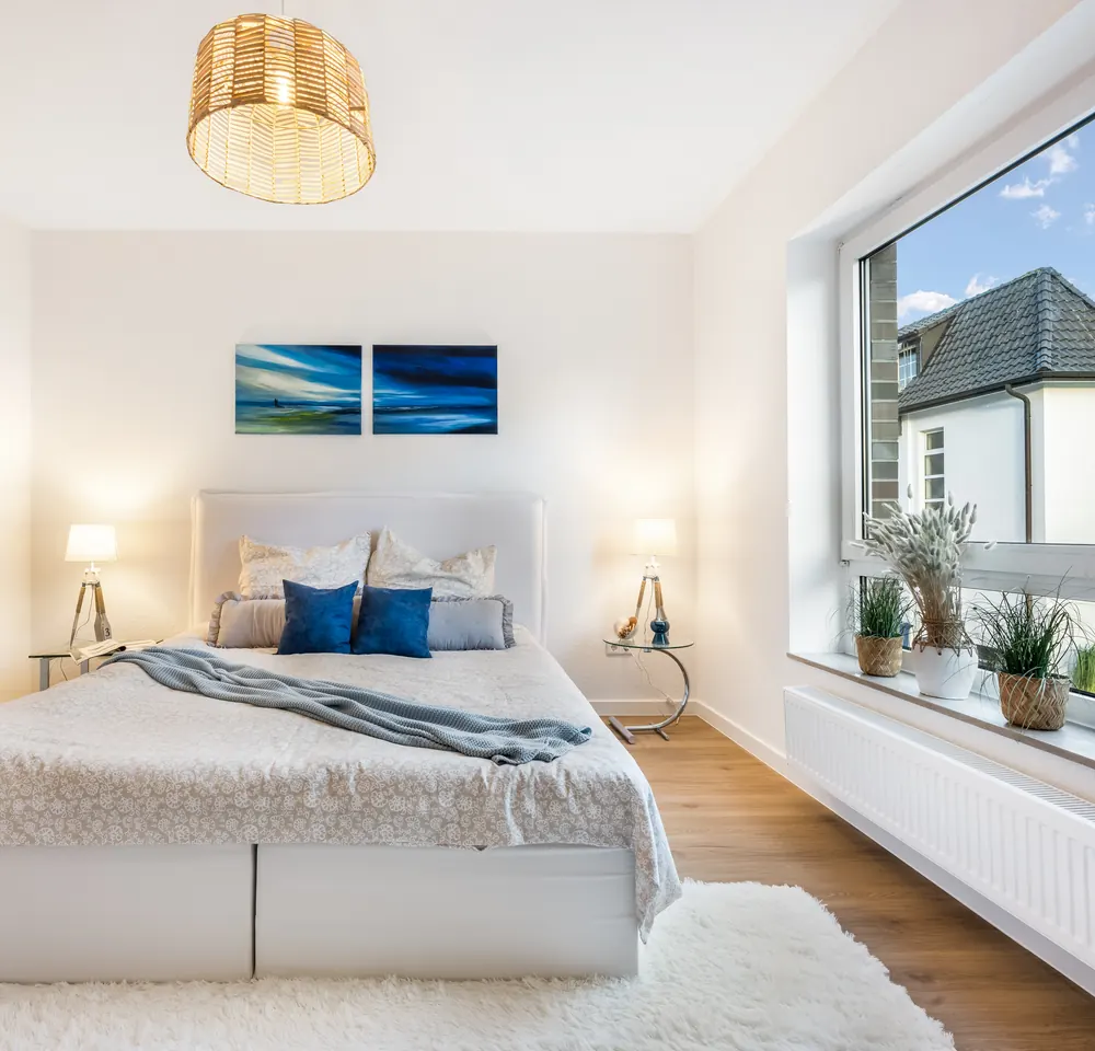 Bright bedroom after natural real estate photo enhancement by PixelShouters