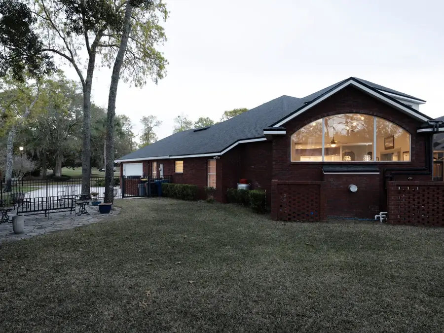Property exterior before twilight sky and lawn enhancement