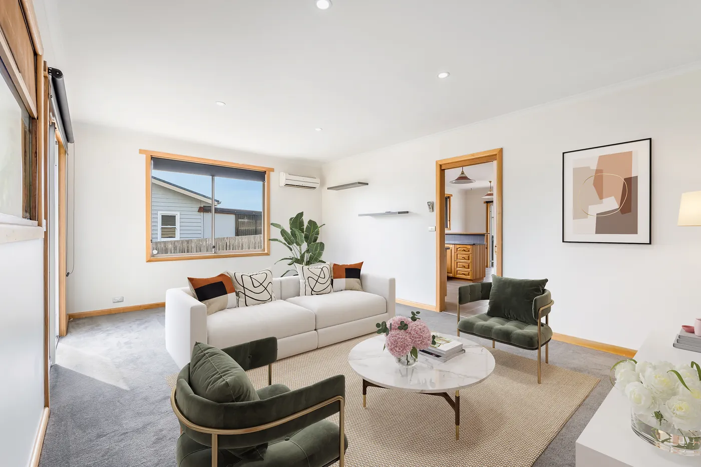 Living room after virtual staging with realistic furniture placement and buyer-friendly styling