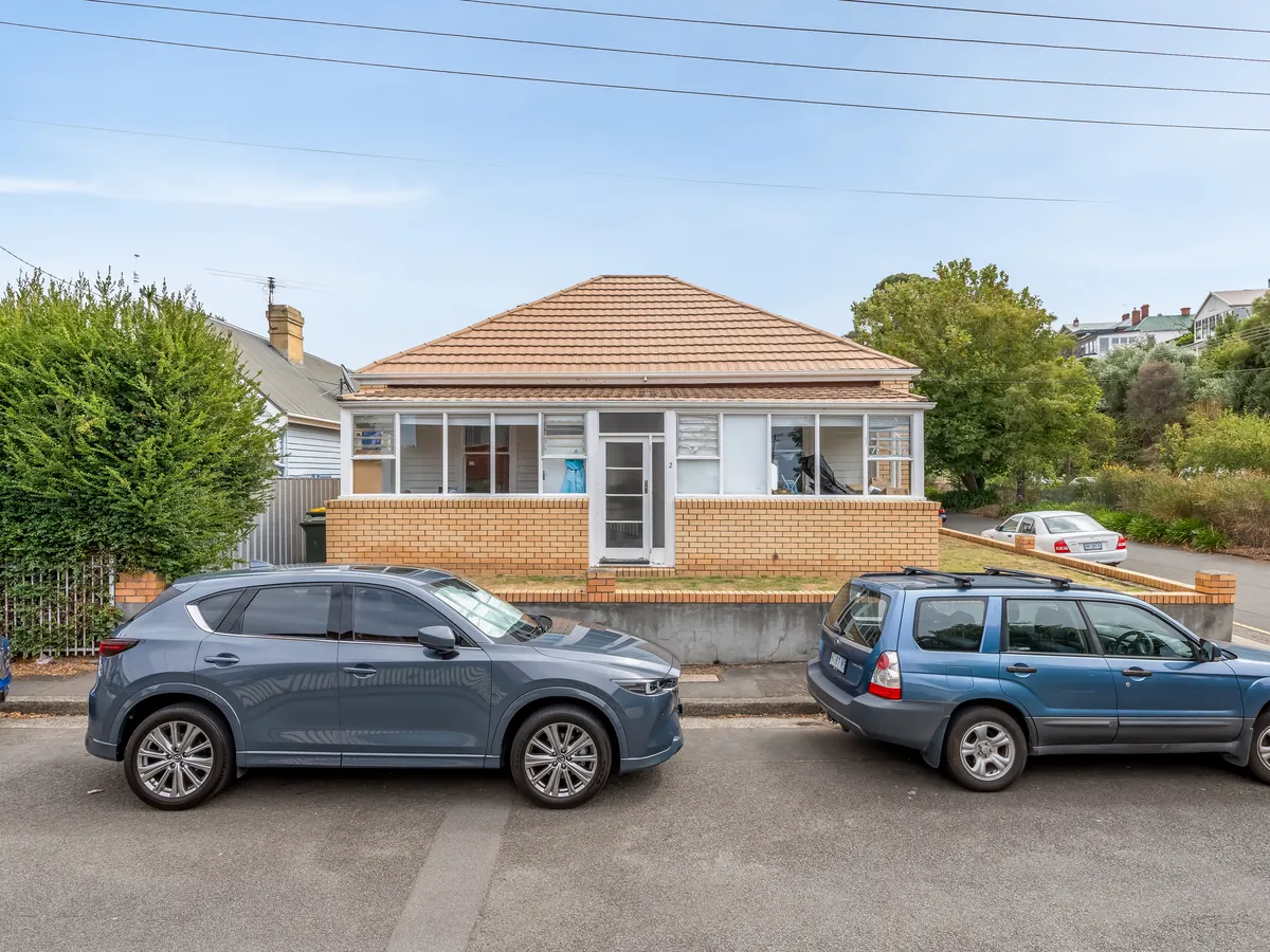 Real estate exterior before parked car removal by PixelShouters