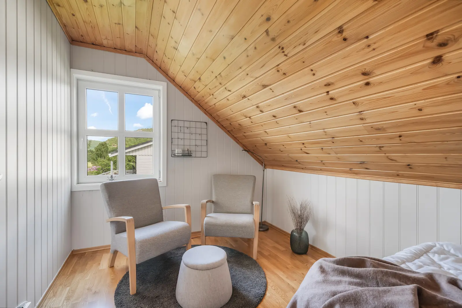 Attic bedroom after bright real estate photo enhancement by PixelShouters