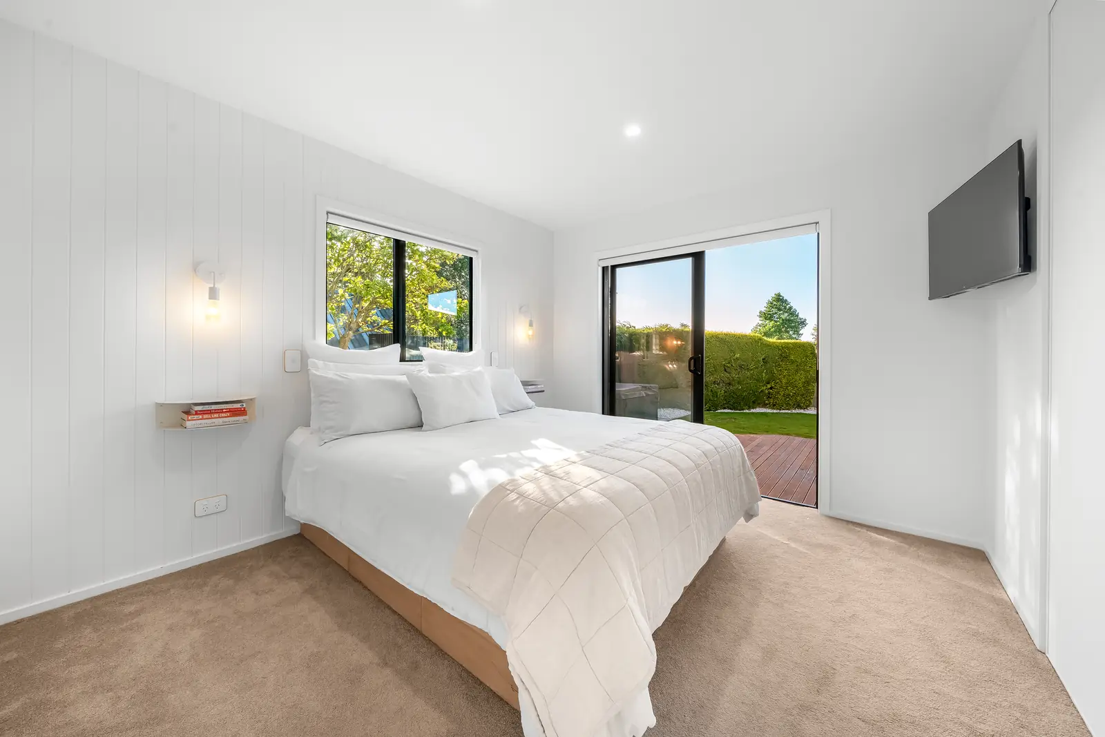 Bright bedroom after real estate photo enhancement with clean color by PixelShouters