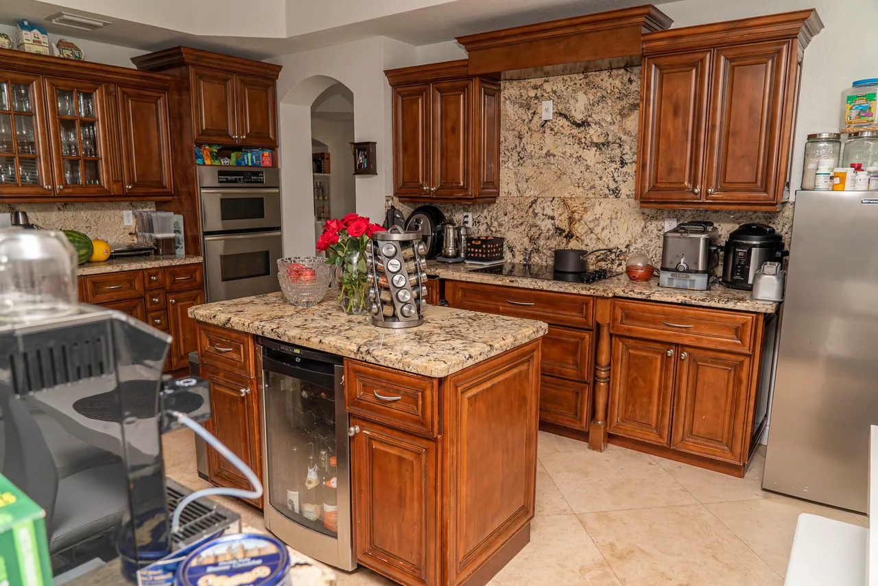 Dated kitchen before real estate virtual renovation by PixelShouters