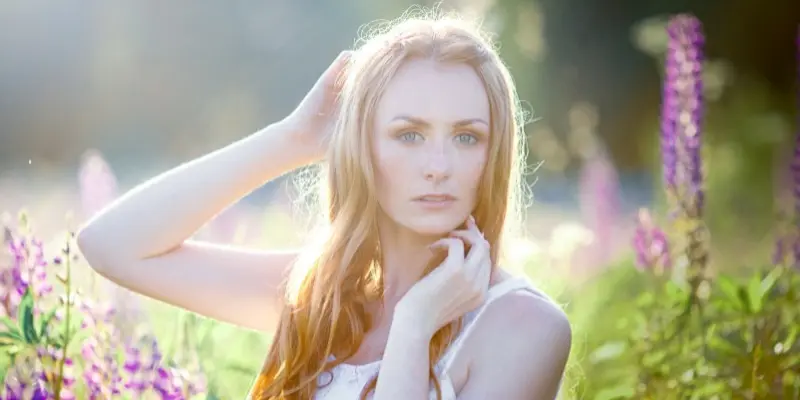 Woman in flower field showing Clean and Natural Photo Editing Style in Different Photo Editing Styles
