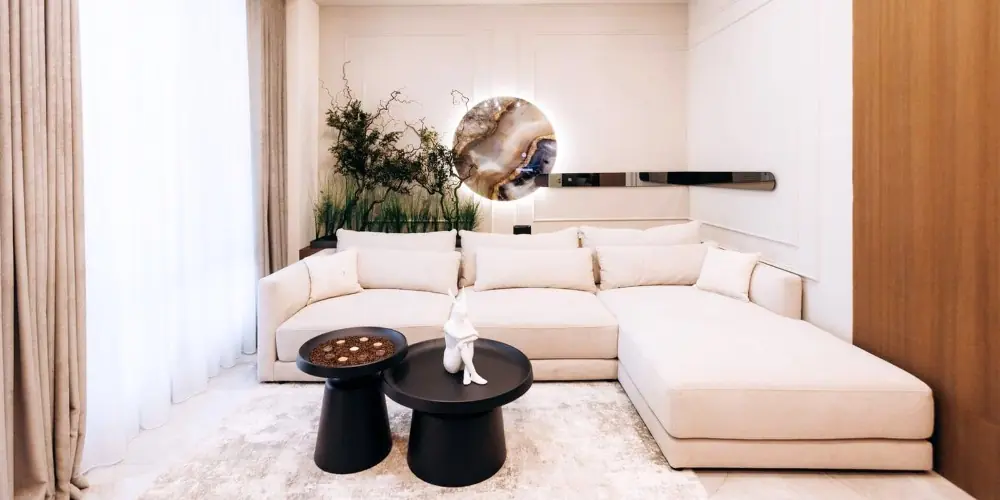 Interior Design Photography showing modern living room styled for camera with white sectional sofa